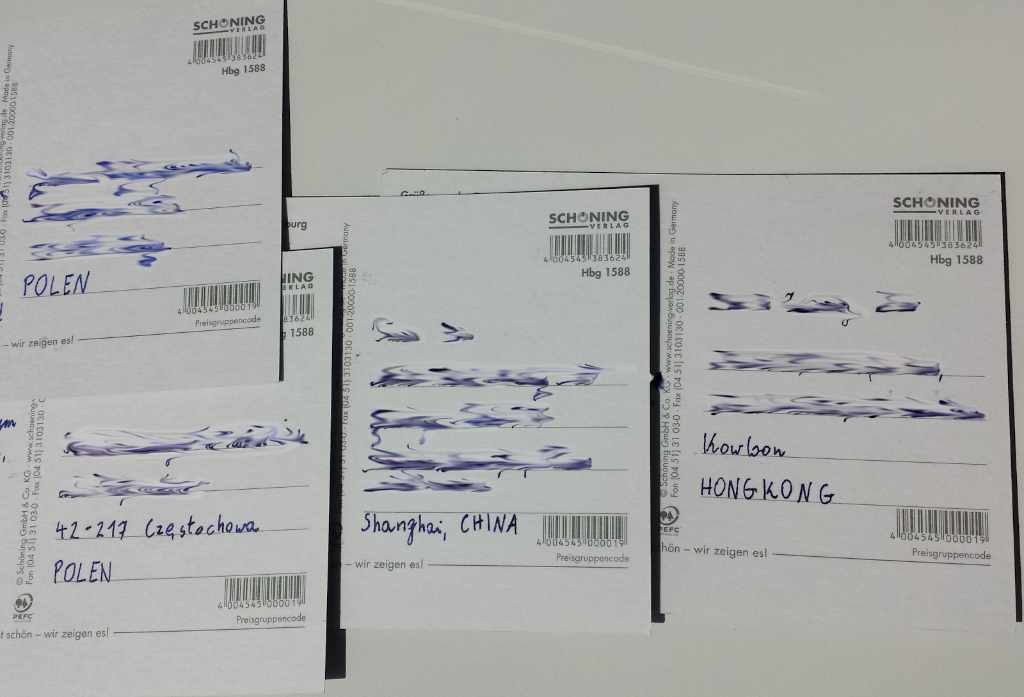 Bunch of postcards with blurred addresses.